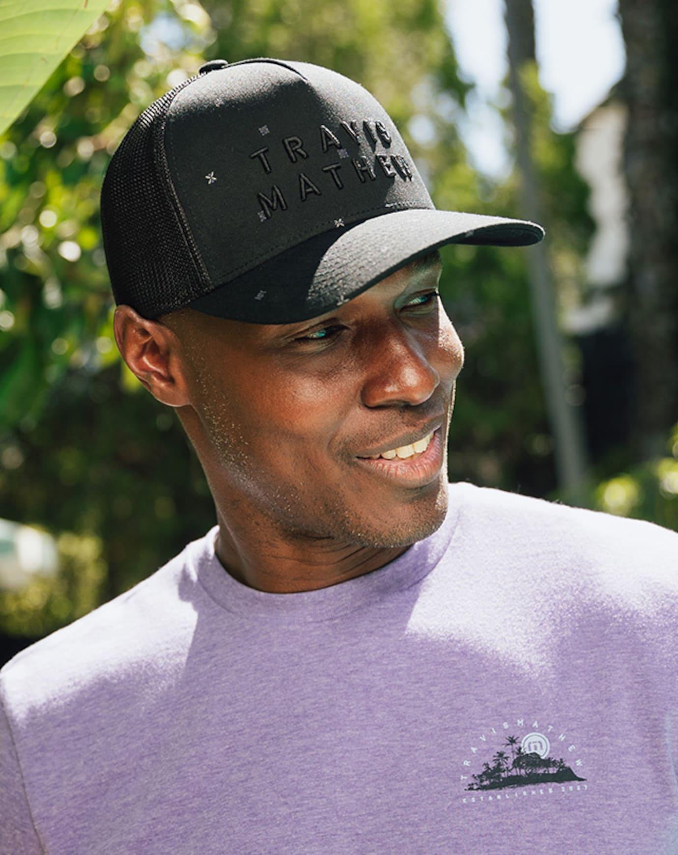 TravisMathew Shipwreck Beach Snapback Hat in the color black.