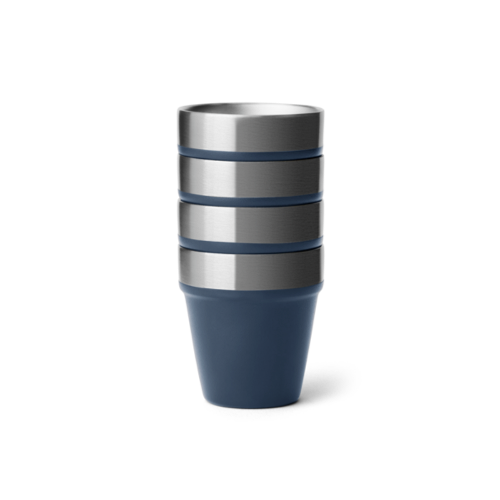 4 navy blue shot glasses stacked on top of one another.